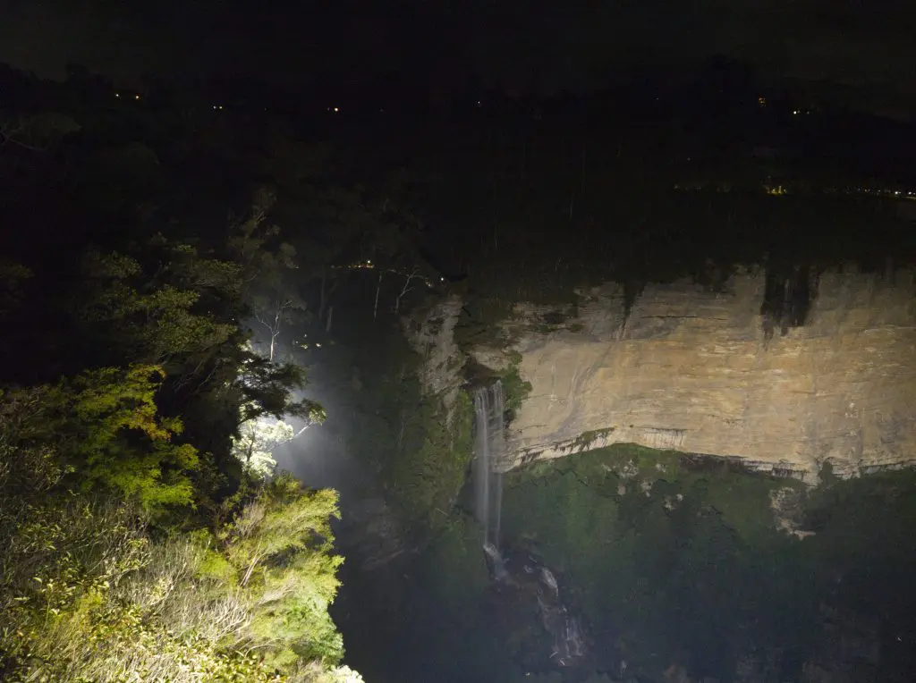 Katoomba Falls lit up by floodlights at night on the Katoomba Falls Reserve Night-lit walk