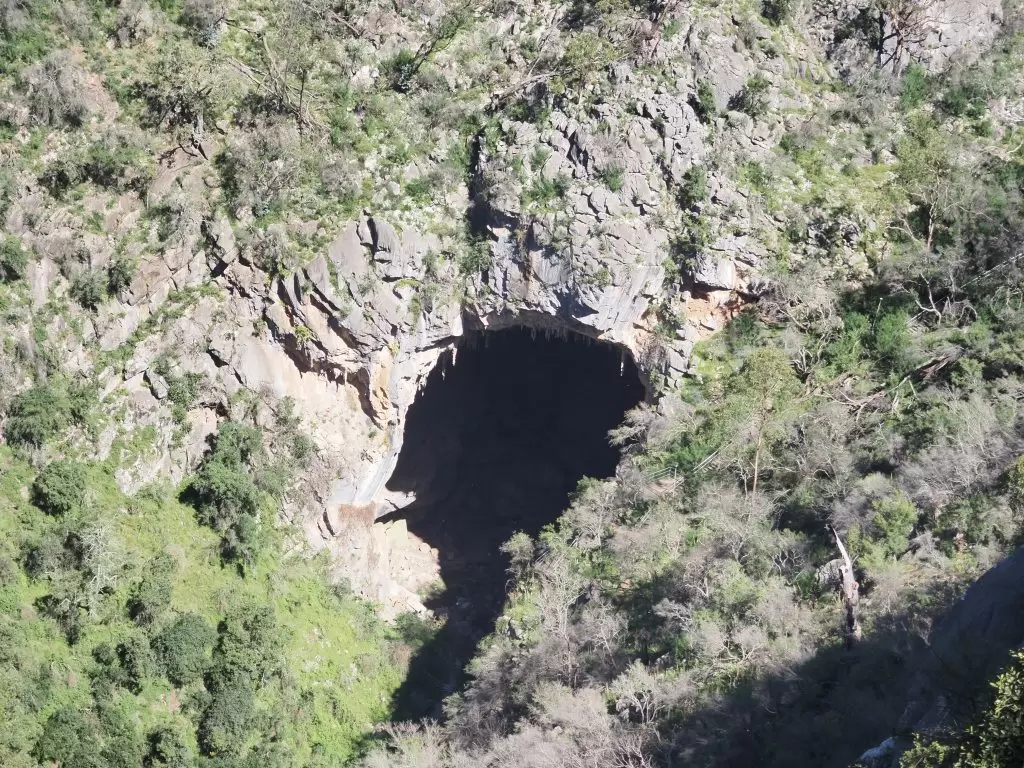 The Devils Coach House cave viewed from above on the path from the Carlotta Carpark down to Caves House at Jenolan Caves in the Blue Mountains