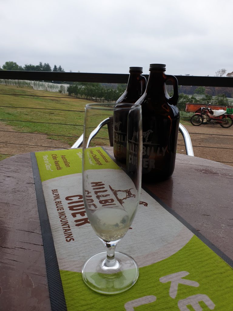 Enjoying a Hillbilly Cider while looking over the apple orchard on their Bilpin property 
