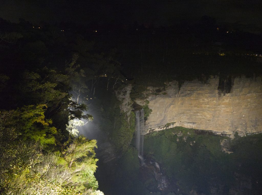 Katoomba Falls lit by spotlight on the Katoomba Falls Reserve night walk