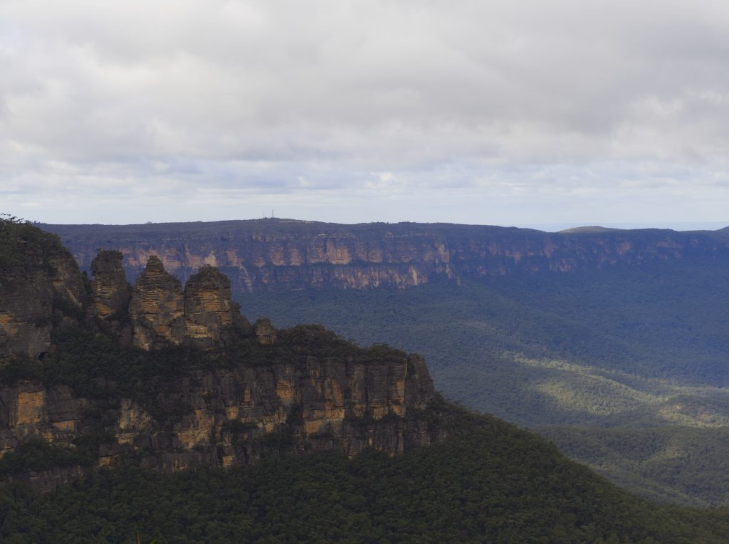 Katoombas Three Sisters as seen from Eagle Hawk lookout. Three columns of sandstone rise from the Jamison Valley