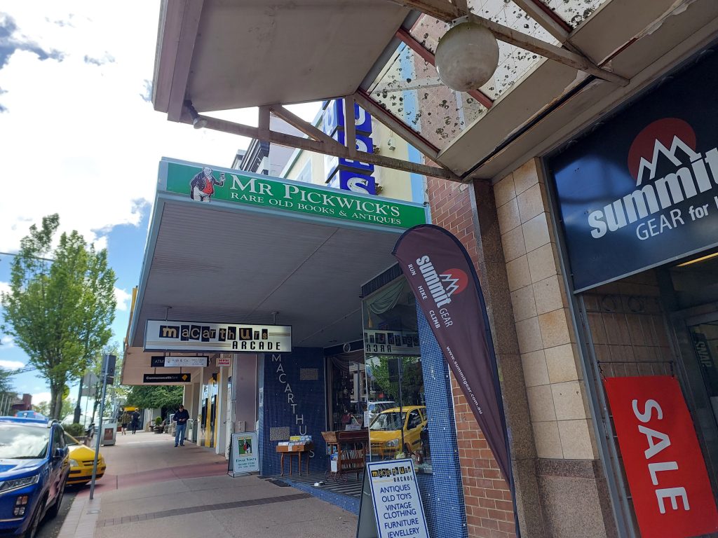 The view of the Mr Pickwicks sign from Katoomba street, it is green and written on the side of the roof over the road.